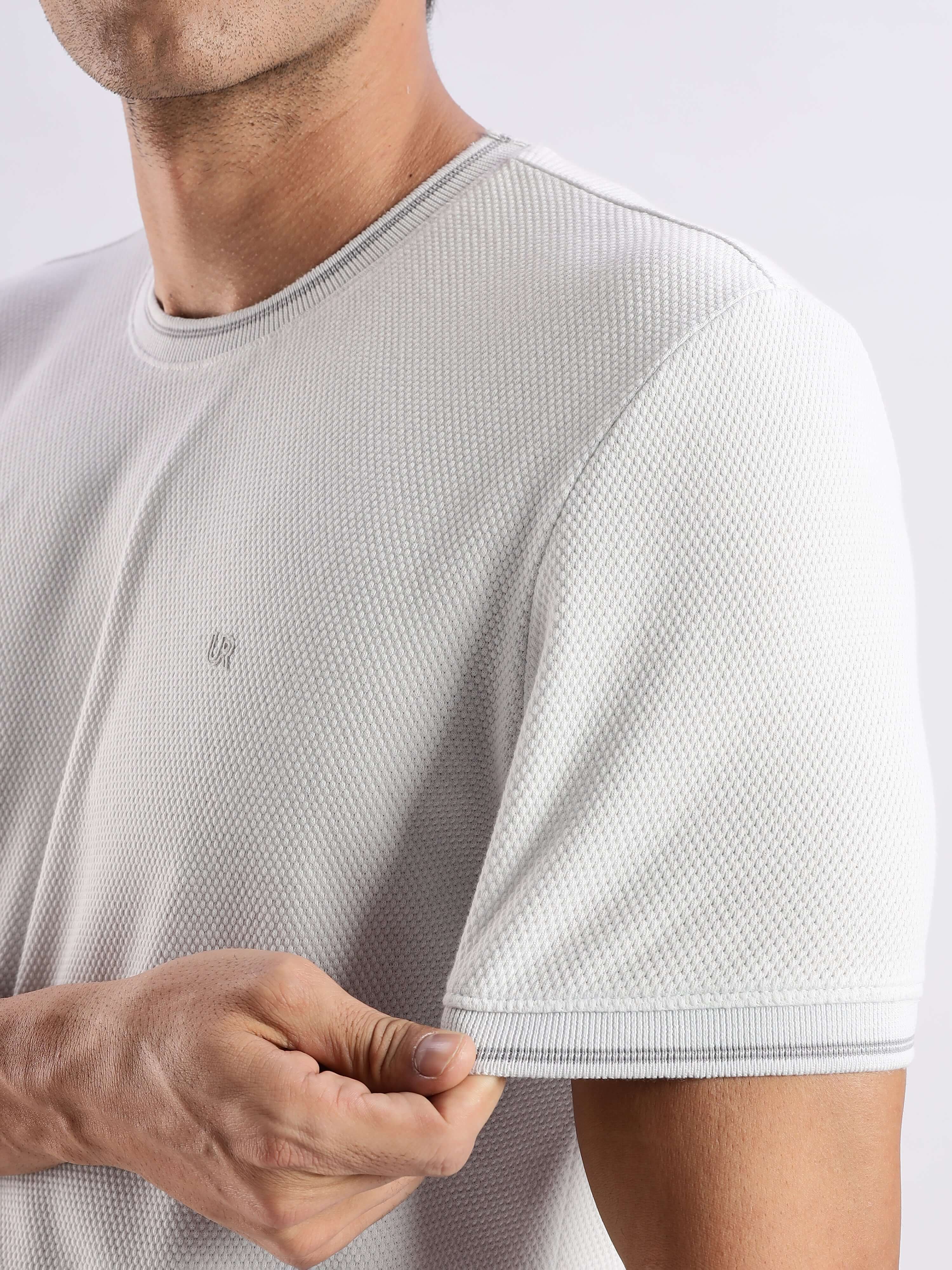 Man wearing a premium Nova Grey knitted shirt showcasing its 8-way stretch and stylish design.