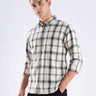 Model wearing the Turms recycled cotton checked shirt, showcasing sustainable fashion with a stylish design.