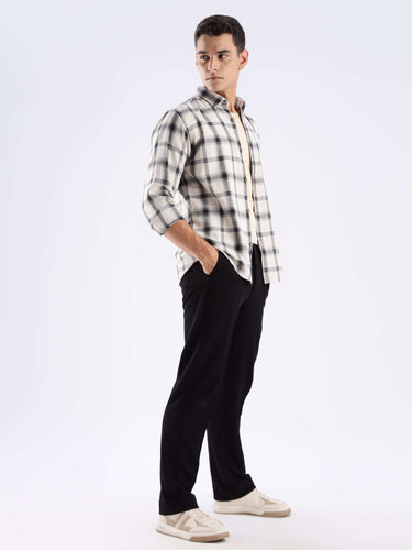 Model wearing a sustainable recycled cotton checked shirt, showcasing style and comfort for everyday use.