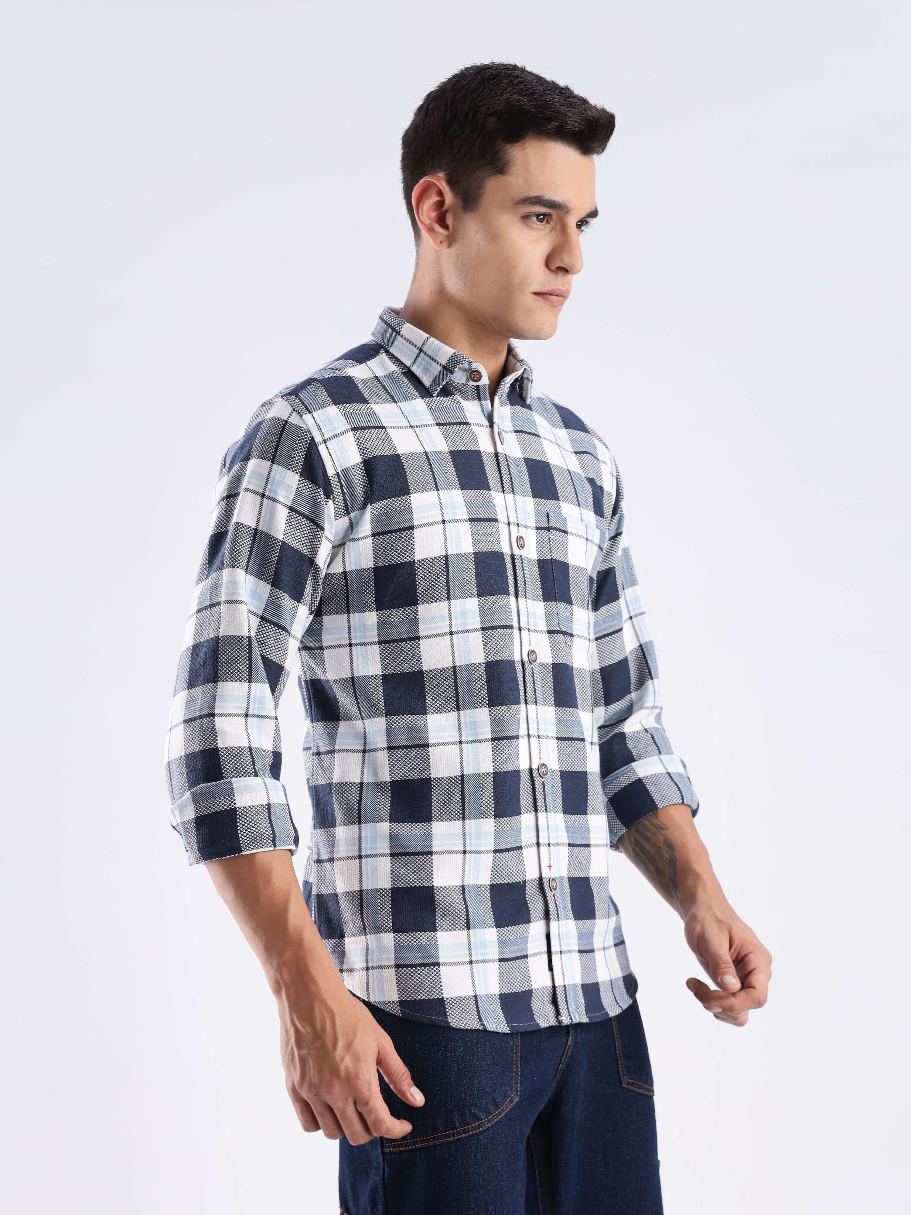 Model wearing the Turms sustainable recycled cotton checked shirt in blue and white, showcasing style and functionality.