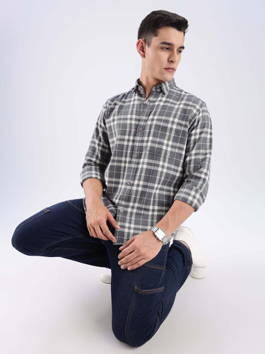 Man wearing a recycled cotton checked shirt in grey, showcasing sustainable style and comfort with cool tech features.
