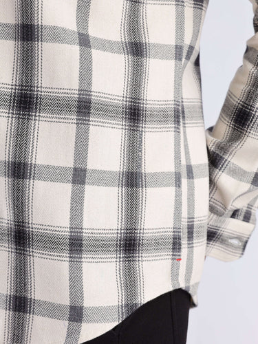 Close-up of the Turms Intelligent recycled cotton checked shirt showcasing its durable weave and stylish design.