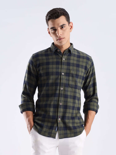 Man wearing a sustainable recycled cotton shirt in a green check pattern, showcasing style and functionality.