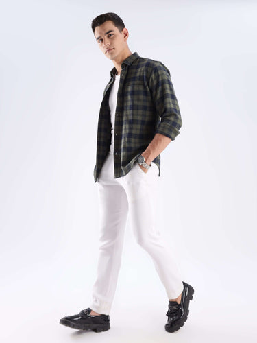 Man wearing a stylish Turms recycled cotton checked shirt, showcasing sustainable fashion and cool tech features.