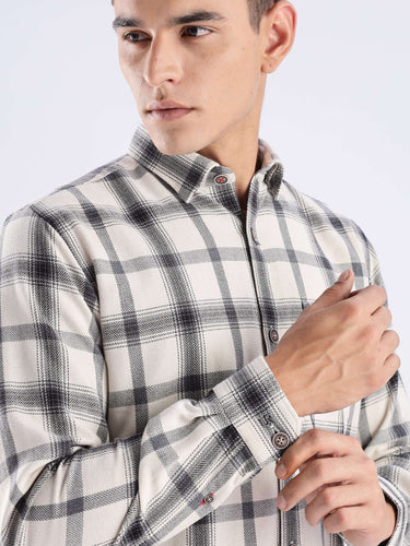 Man wearing a stylish plaid recycled cotton shirt, showcasing the premium fabric and sleek design.