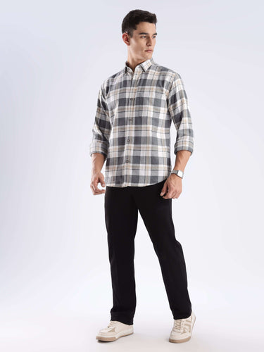 Man wearing Urban Ochre Turms recycled cotton checked shirt with cool tech features, highlighting sustainable fashion.