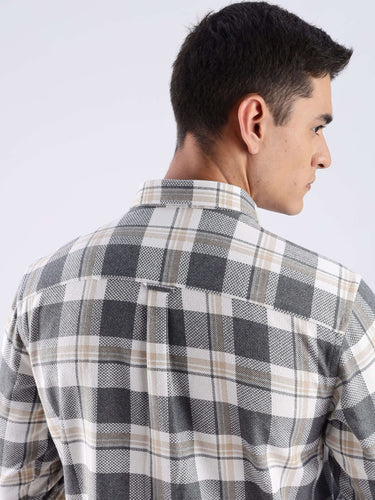 Model showcasing the back of an Urban Ochre Turms recycled cotton checked shirt, highlighting its durable weave and stylish design.