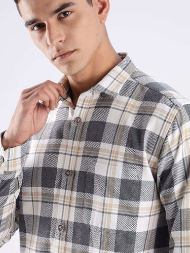 Model wearing Urban Ochre recycled cotton checked shirt, showcasing sustainable fashion with cool tech features.