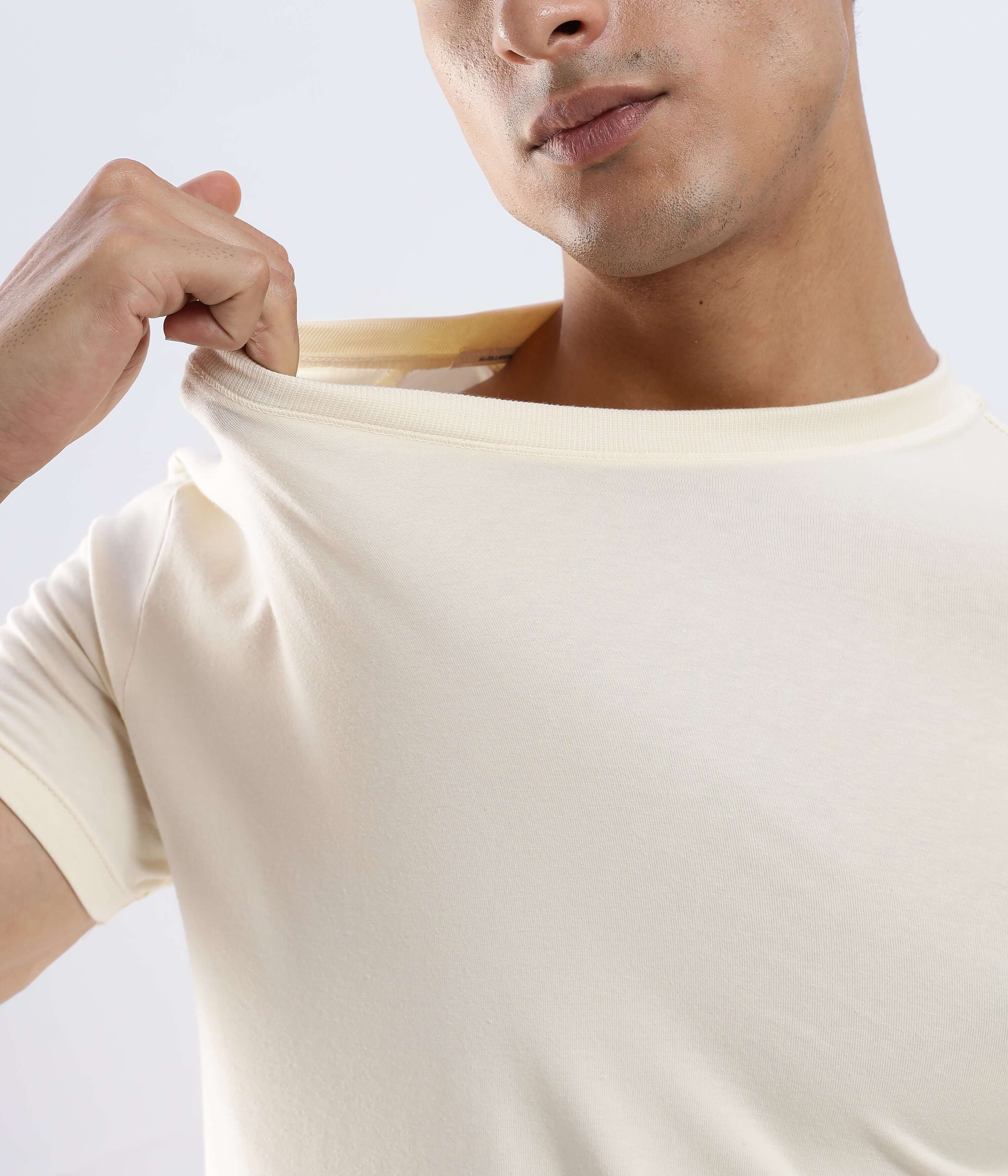 Polar Off-white cotton tshirt worn by a man, showcasing its stretchable and comfortable design.