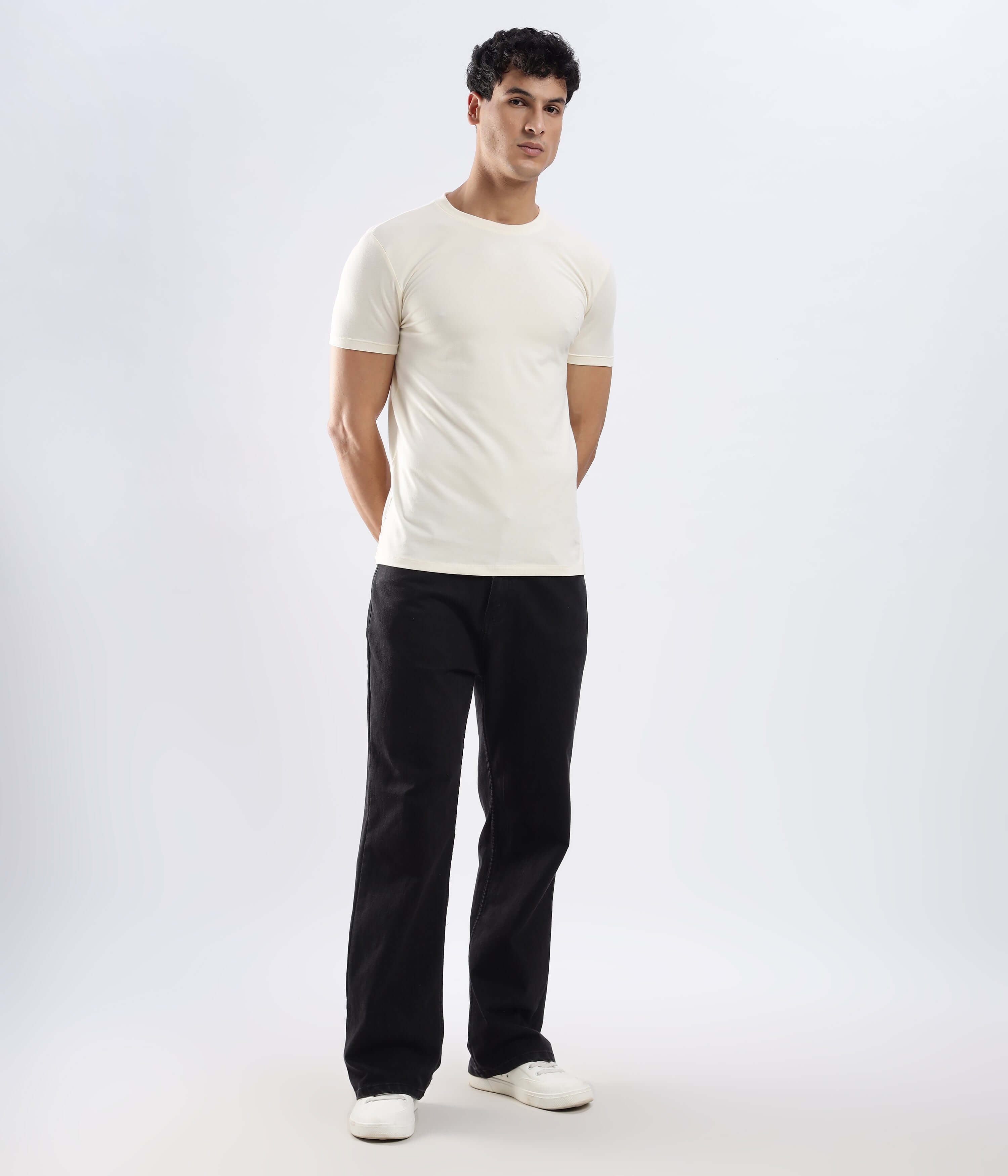 Model wearing Polar Off-white cotton t-shirt, showcasing its stretchable, waterproof, and anti-odour features.