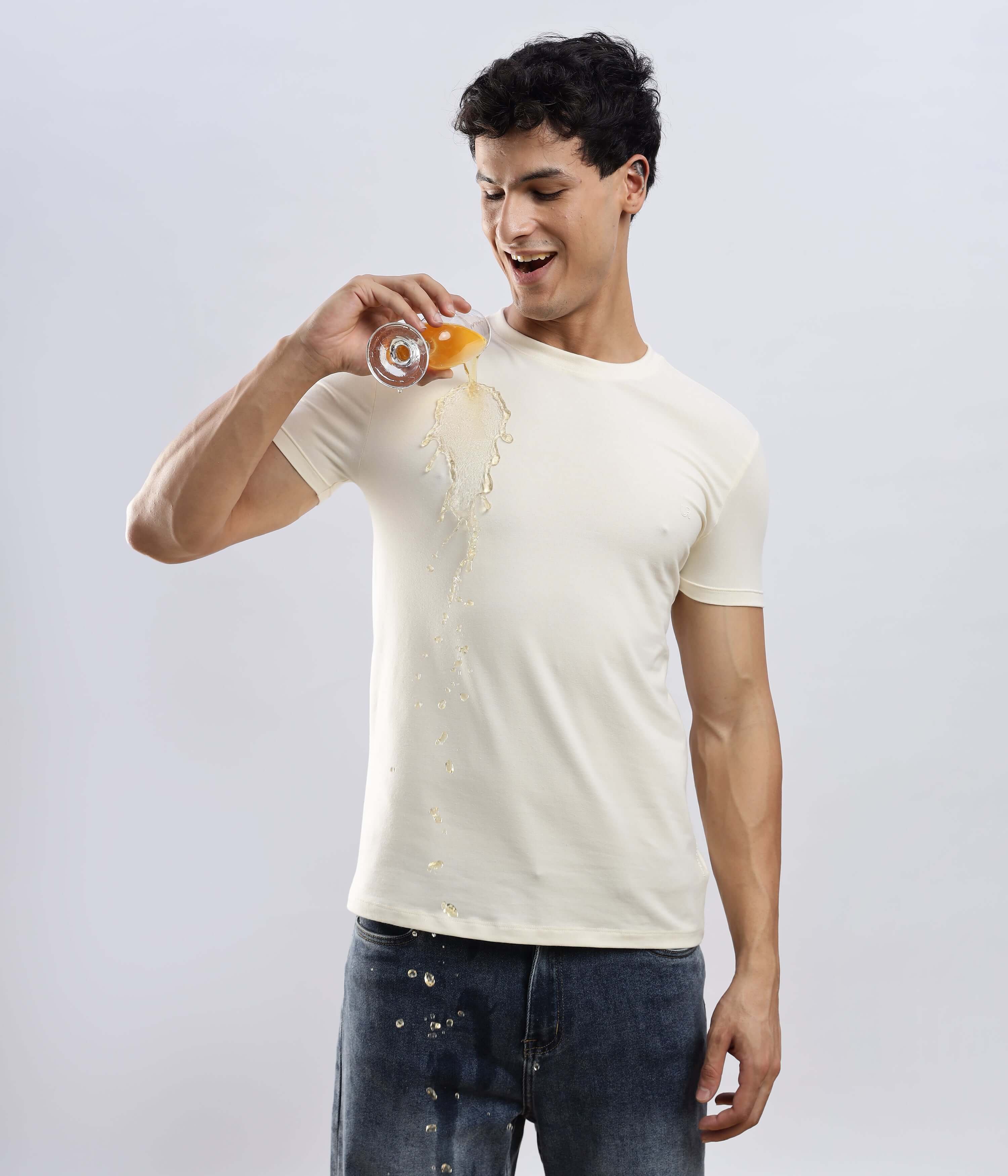Polar Off-white t-shirt showcasing its waterproof feature with a splash of beverage.