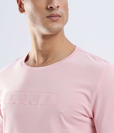Model wearing Quartz Pink Turms Worry-Free Intelligent T-Shirt, showcasing stylish cotton fabric and modern design.