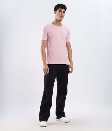 Model wearing Quartz Pink Turms Worry-Free Intelligent T-Shirt, showcasing style and comfort in breathable cotton.