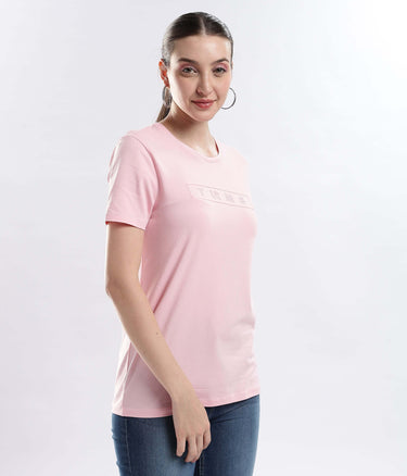 A model wearing a Womens casual t-shirt Quartz Pink cotton t-shirt, showcasing its stretchable and water-proof features.