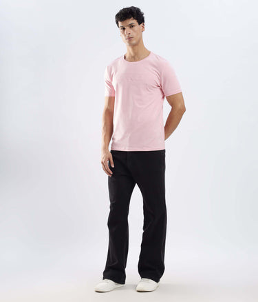 Model wearing Quartz Pink cotton tshirt, showcasing its stretchable, waterproof, and anti-odour features.