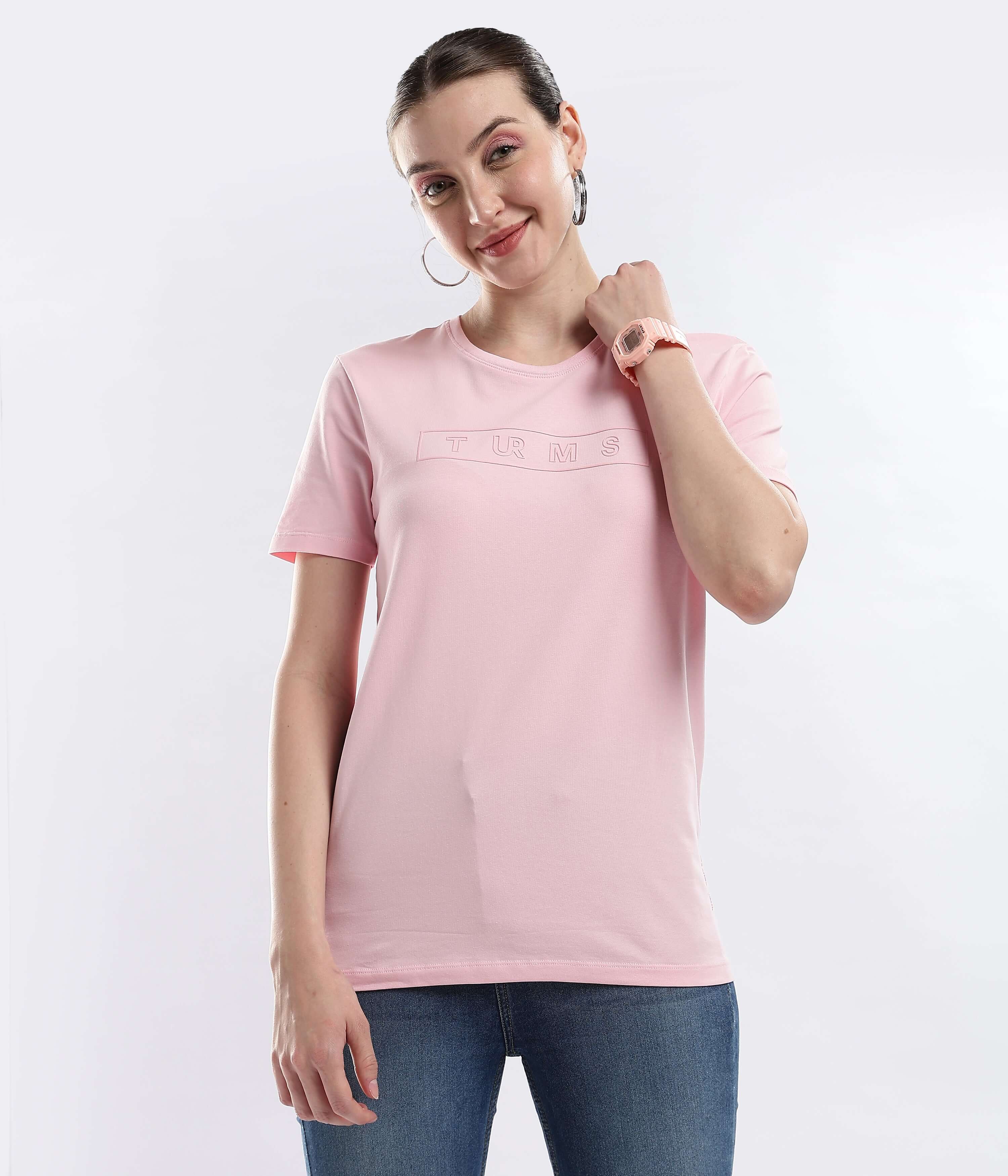 Woman wearing Womens casual t-shirt Quartz Pink Turms cotton tshirt, showcasing its stylish and comfortable design.