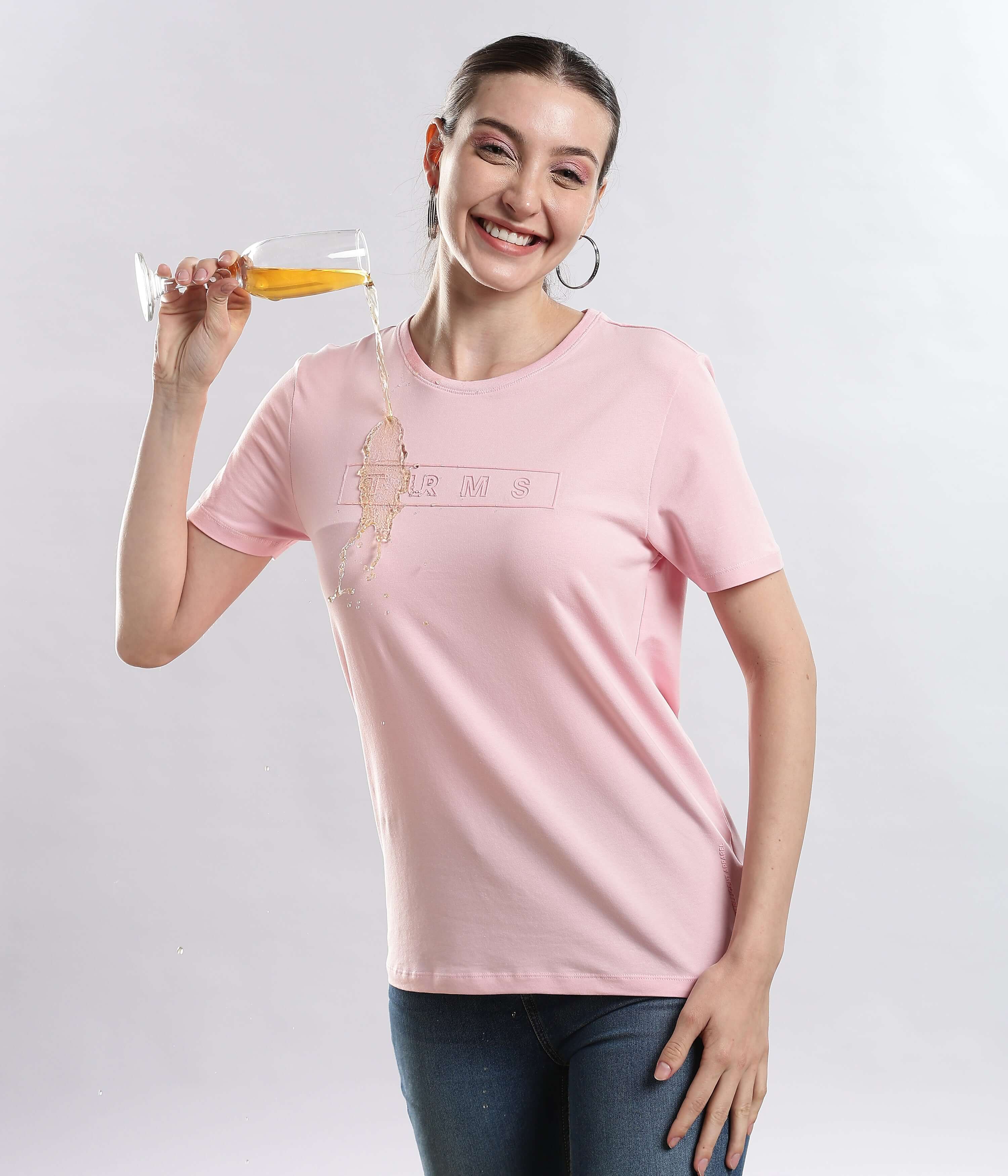 Model wearing Womens casual t-shirt Quartz Pink T-shirt, enjoying a drink, showcasing style, comfort, and durability of the best t-shirt.