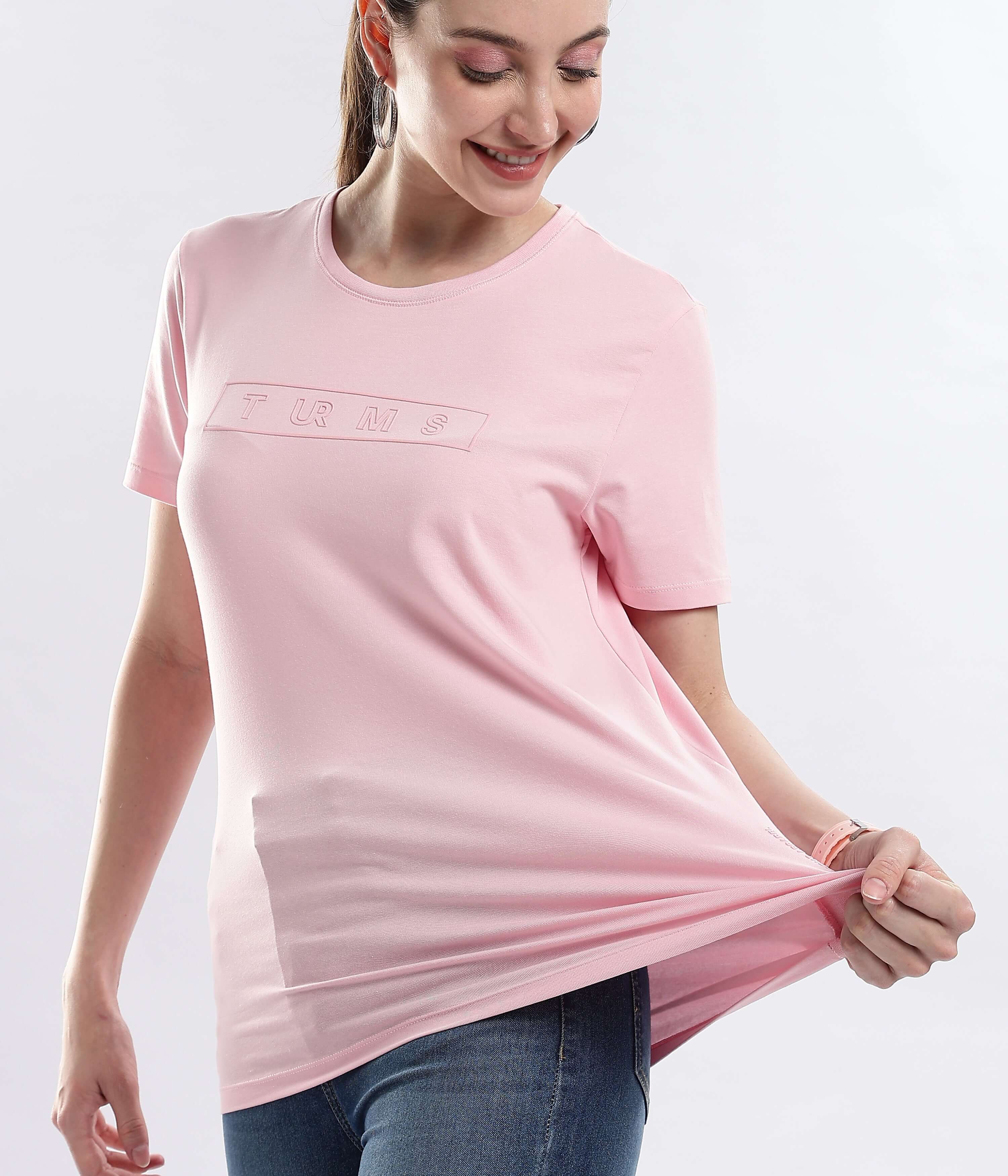 Model wearing Womens casual t-shirt Quartz Pink stretchable cotton t-shirt, showcasing water proof and anti odour features.