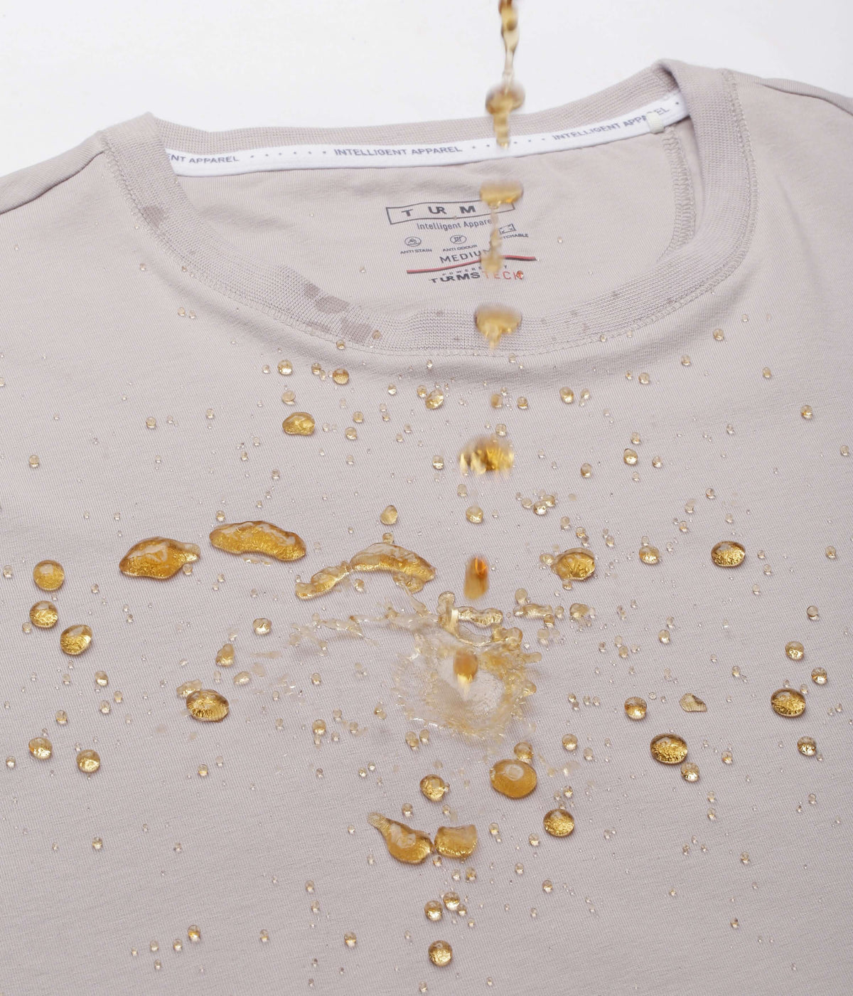 Panther Grey Turms intelligent apparel t-shirt demonstrating water resistance and durability features.