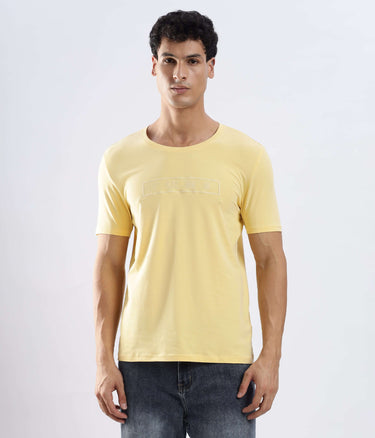 Aura Yellow cotton t-shirt worn by a model, showcasing its stretchable and water-proof features.