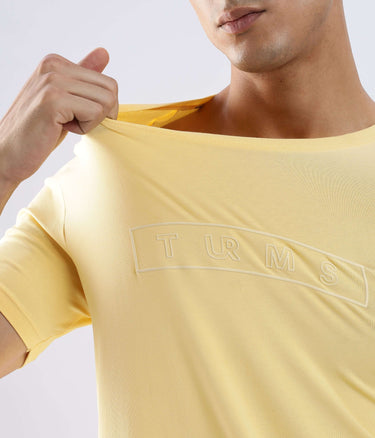 Model showcasing the Aura Yellow Turms cotton tshirt, designed for style and comfort with anti-odour features.