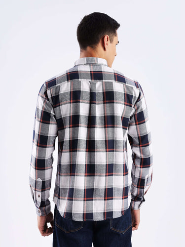 Back view of a man wearing a stylish blue and white checked shirt made from recycled cotton.