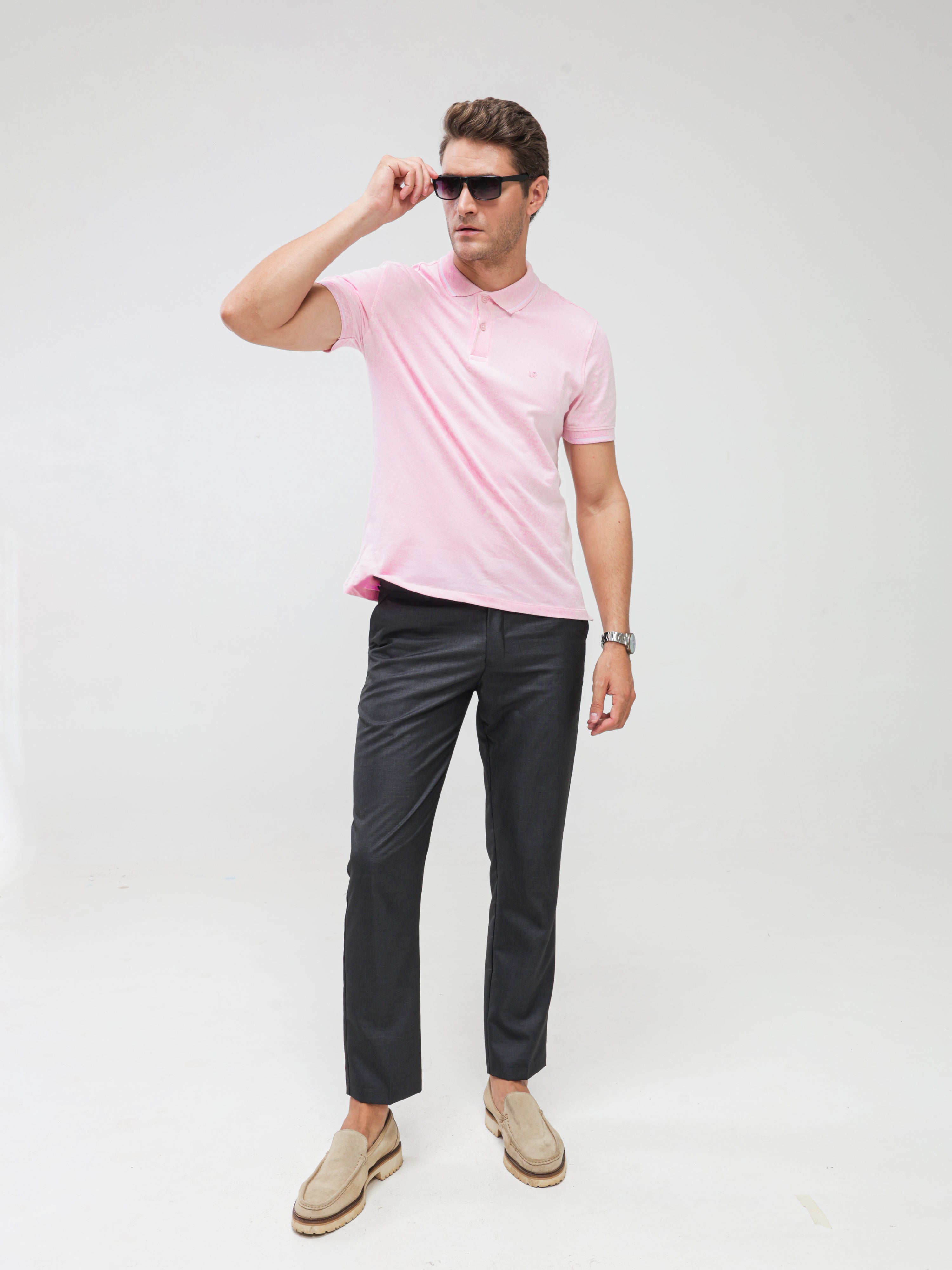 Man wearing pink Turms Polo T-shirt, tailored fit, anti-stain, anti-odor, premium cotton blend, best tshirts for men, menswear, water resistant.
