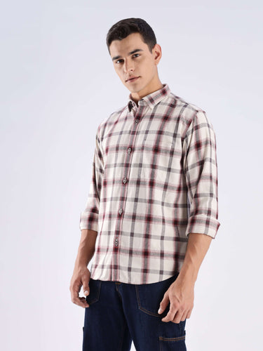 Model wearing a rustic wood recycled cotton checked shirt, showcasing its stylish design and sustainable fabric.