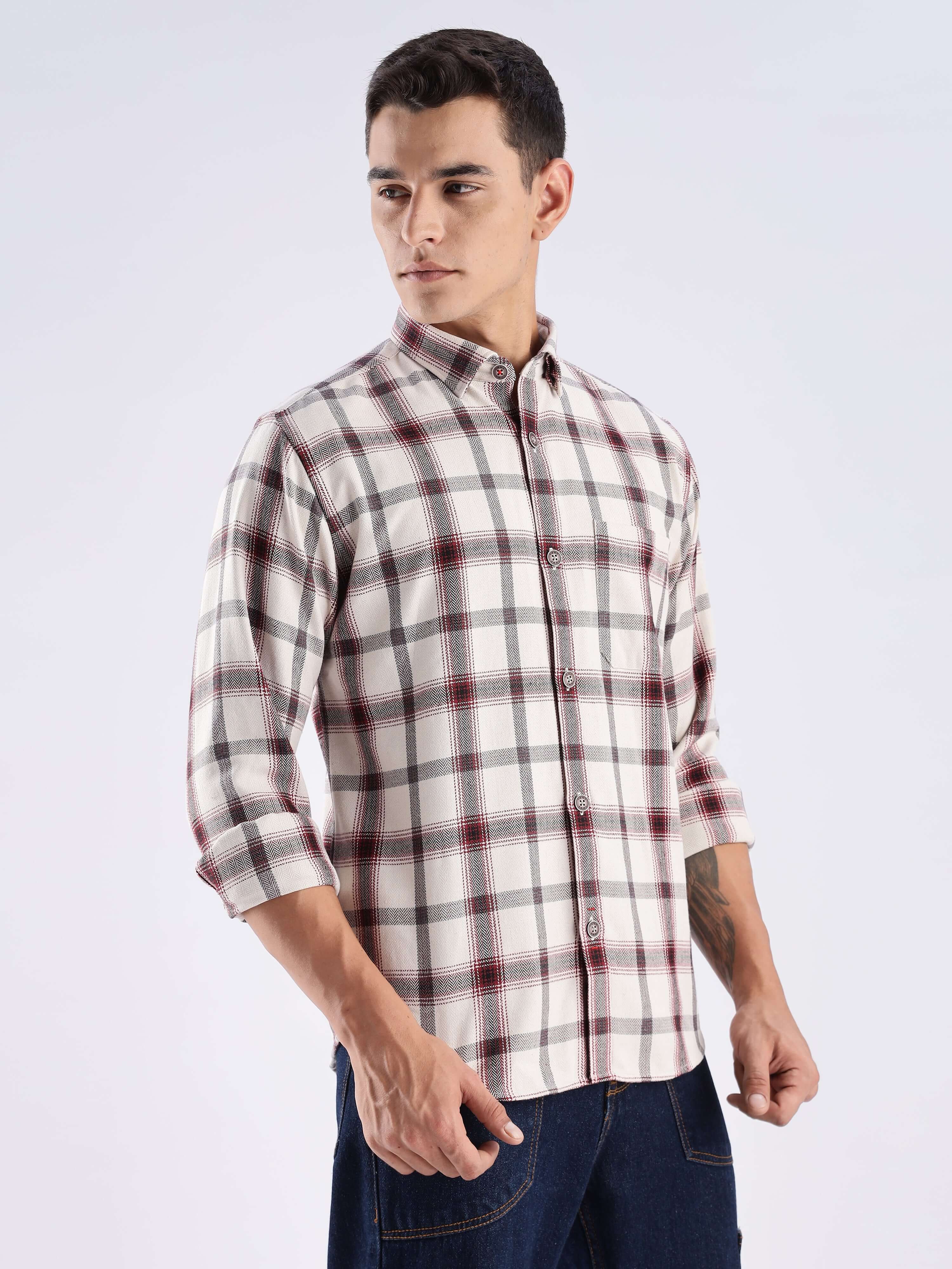 Man wearing a rustic recycled cotton check shirt, showcasing sustainable fashion and durability for everyday luxury.