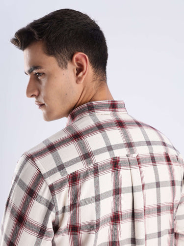 Man wearing a rustic wood recycled cotton checked shirt, showcasing its durable fabric and stylish design from the back.