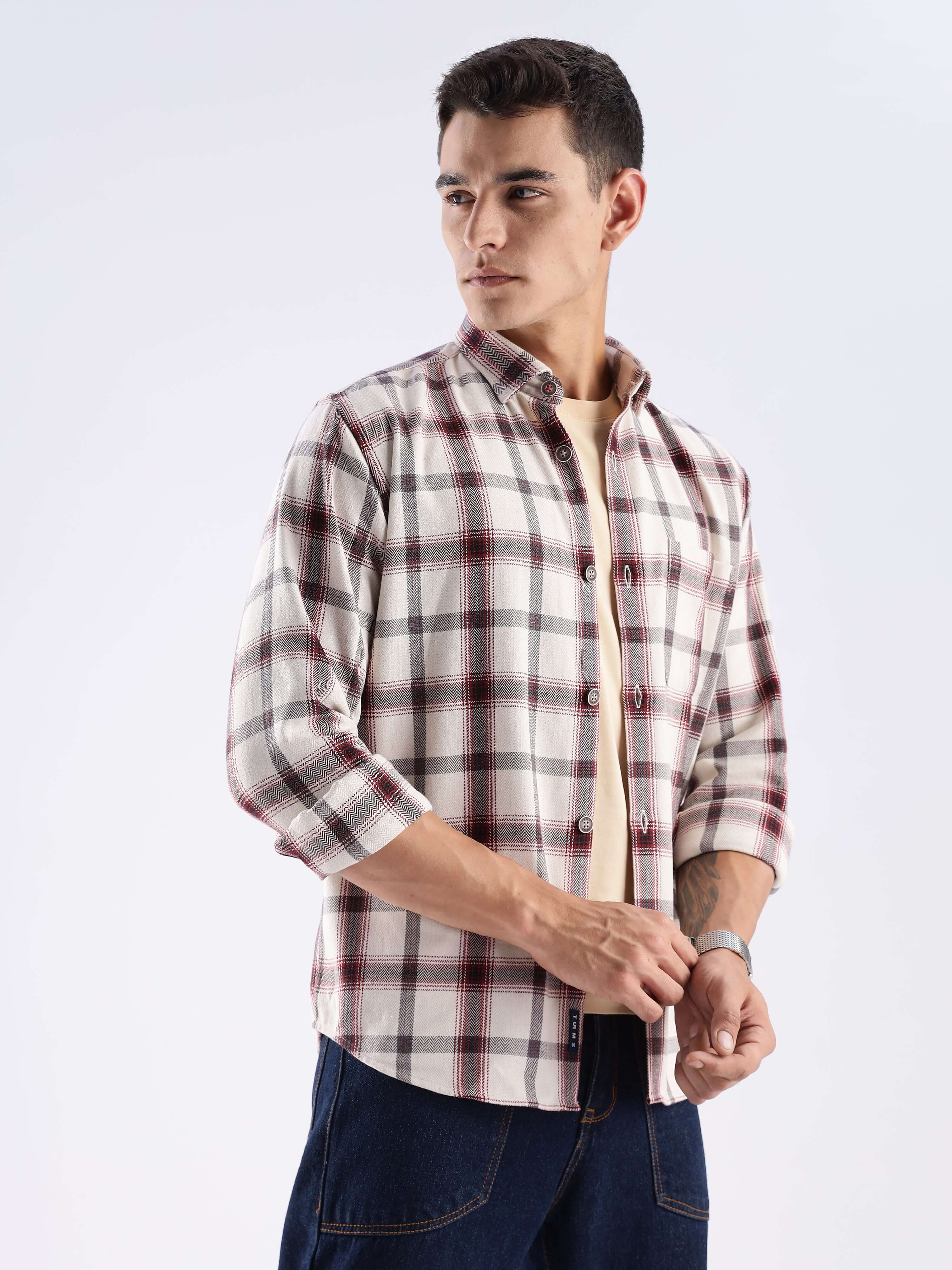 Man wearing a stylish recycled cotton checked shirt, showcasing sustainable fashion with cool tech features.