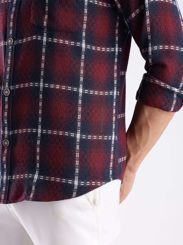 Close-up of a stylish Turms recycled cotton checkered shirt in navy and red, showcasing its durable weave and trendy design.