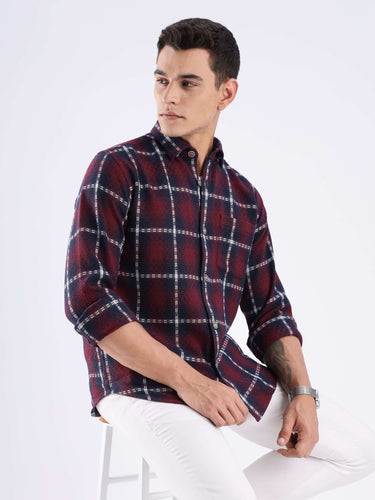 Man wearing a stylish Turms recycled cotton checked shirt, showcasing sustainable fashion and cool tech features.