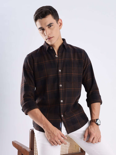 Model wearing a rustic nightshade recycled cotton checked shirt, showcasing style and sustainable fashion.