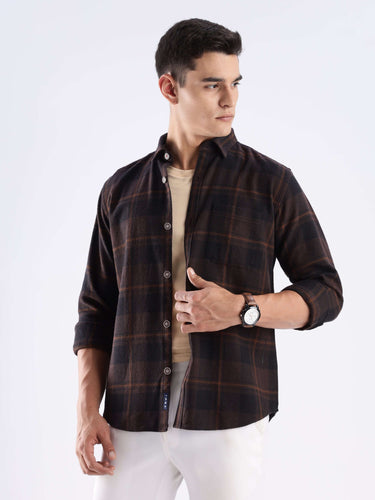 Model wearing Rustic Nightshade recycled cotton checked shirt, showcasing its stylish and sustainable design.