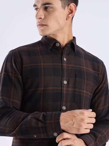 Model wearing a Rustic Nightshade recycled cotton shirt with check pattern, showcasing its sustainable and stylish design.