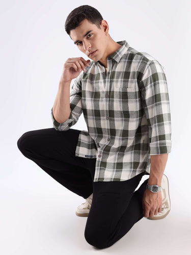 Model wearing the Mint Falls check shirt made from recycled cotton, featuring anti-odour and water-repellent technology.