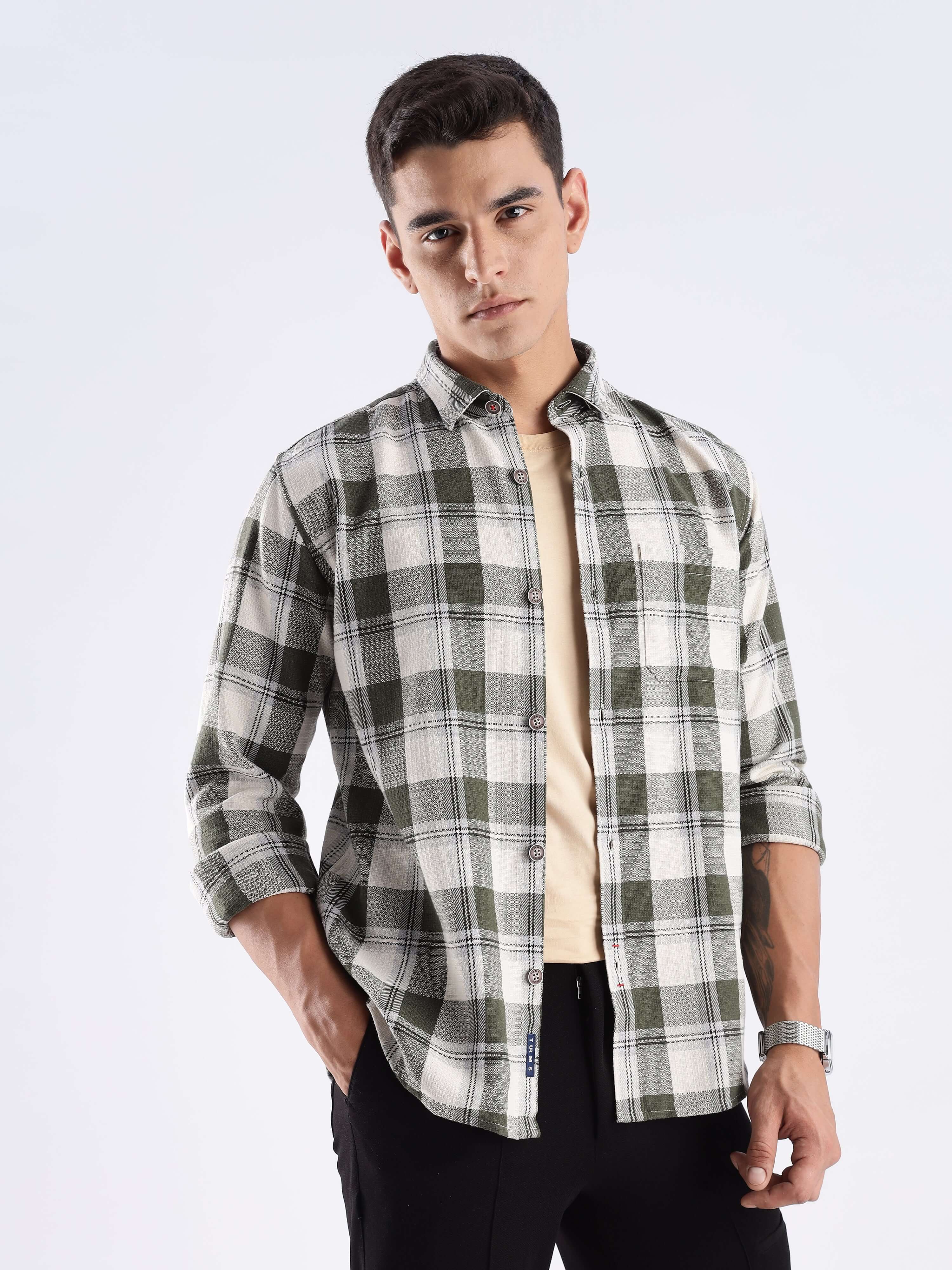 Stylish male model wearing a mint recycled cotton checked shirt, showcasing sustainable fashion and everyday luxury.