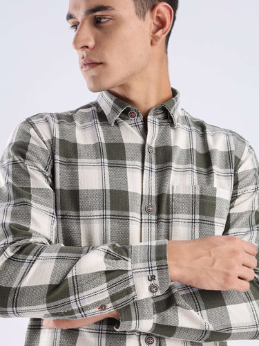 Man wearing a Mint Falls recycled cotton checked shirt, featuring a modern design and sustainable fabric.