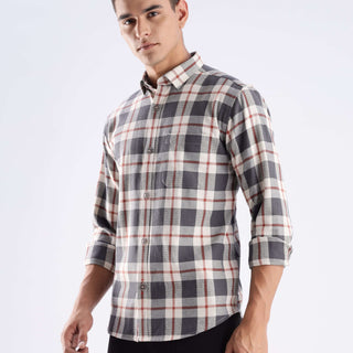 Man wearing a grey plaid recycled cotton shirt showcasing style and durability with sustainable features.