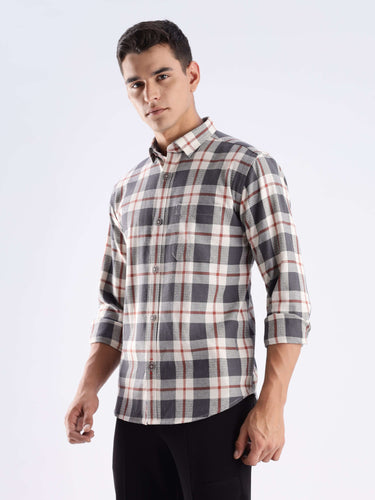 Man wearing a grey plaid recycled cotton shirt showcasing style and durability with sustainable features.