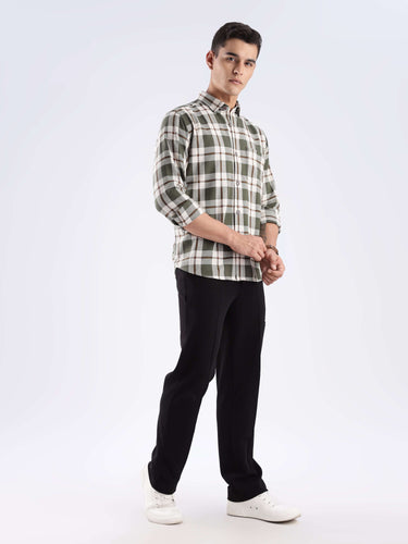 Man in Meteor Green recycled cotton checked shirt, showcasing sustainable fashion and stylish design for everyday luxury.