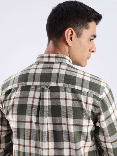 Back view of a man wearing the Meteor Green checked recycled cotton shirt, showcasing the style and eco-friendly fabric.