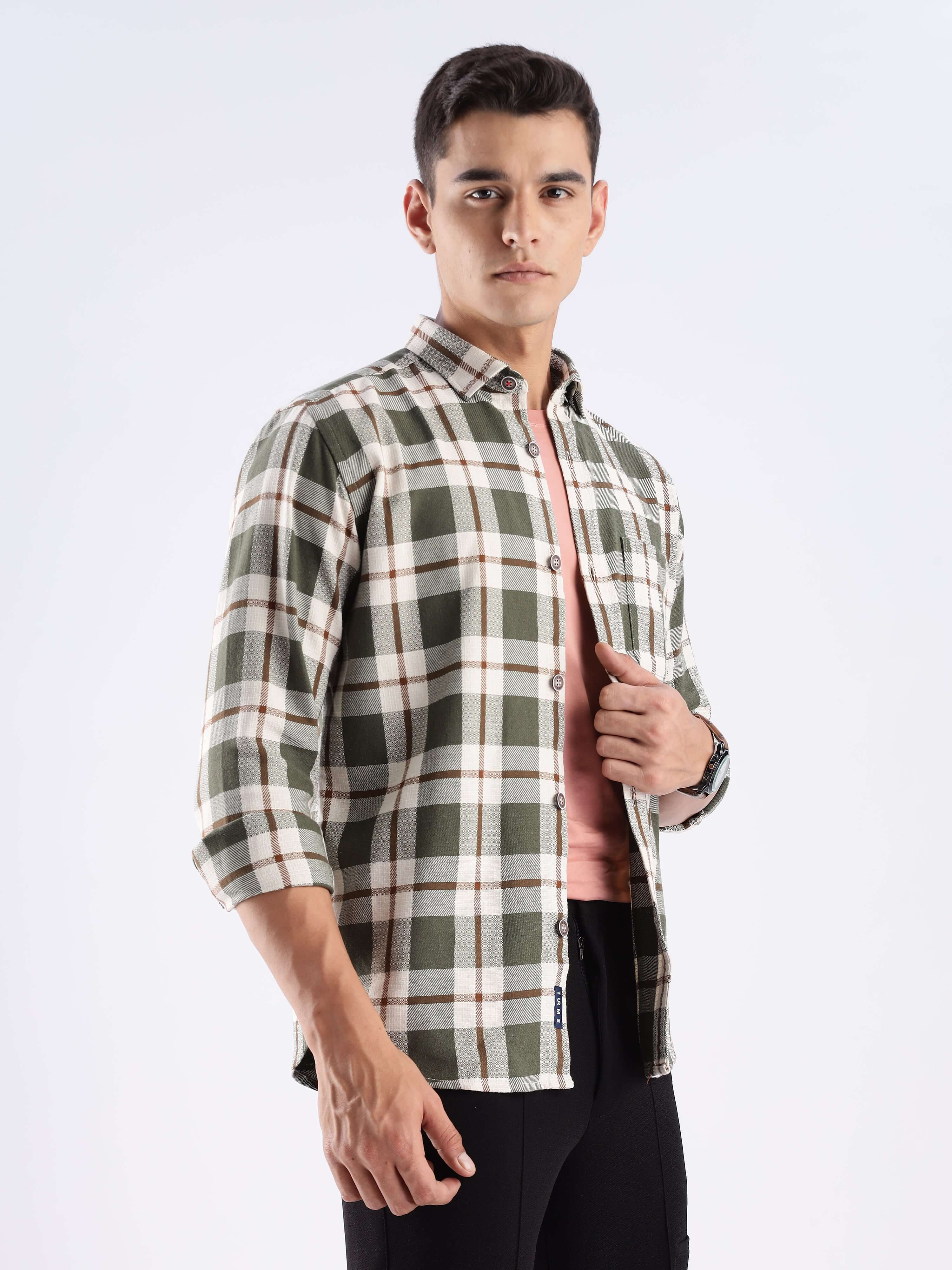 Stylish man wearing a checked recycled cotton shirt, showcasing sustainable fashion with anti-odour and water-repellent features.