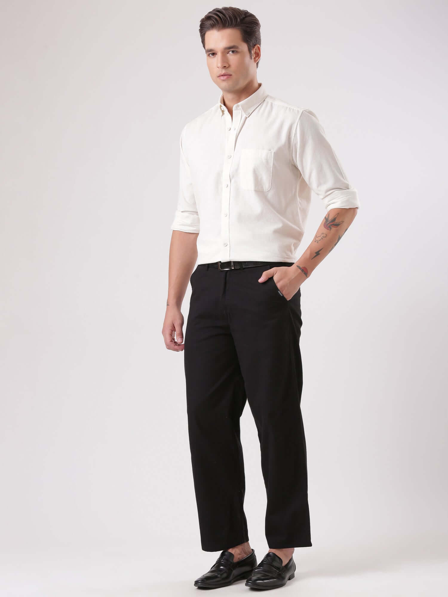 Model wearing the White Grizzly Turms Ultra Luxe Intelligent Corduroy Shirt with black trousers.