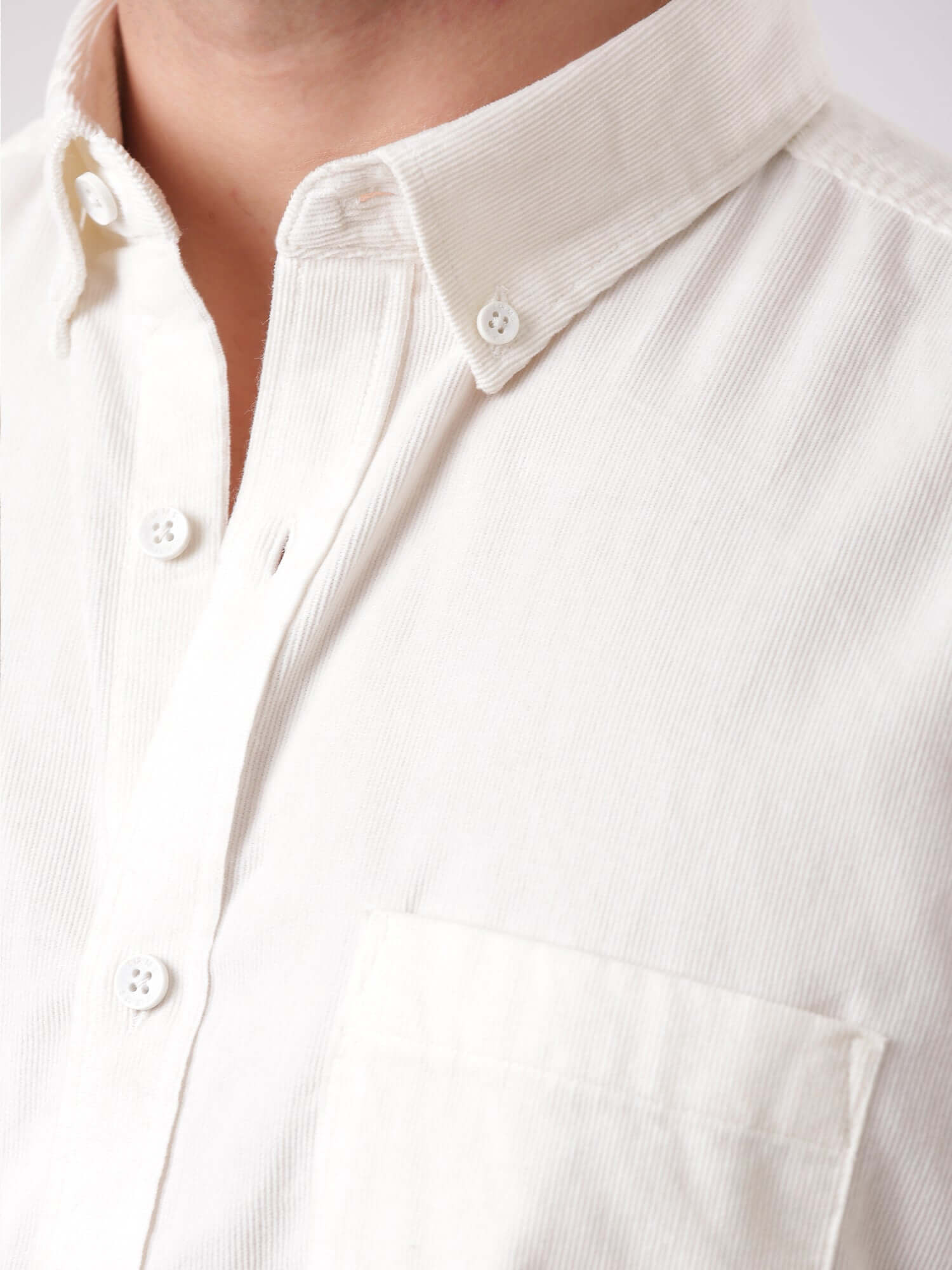 White Grizzly corduroy shirt showcasing premium fabric and crisp collar detail for men.